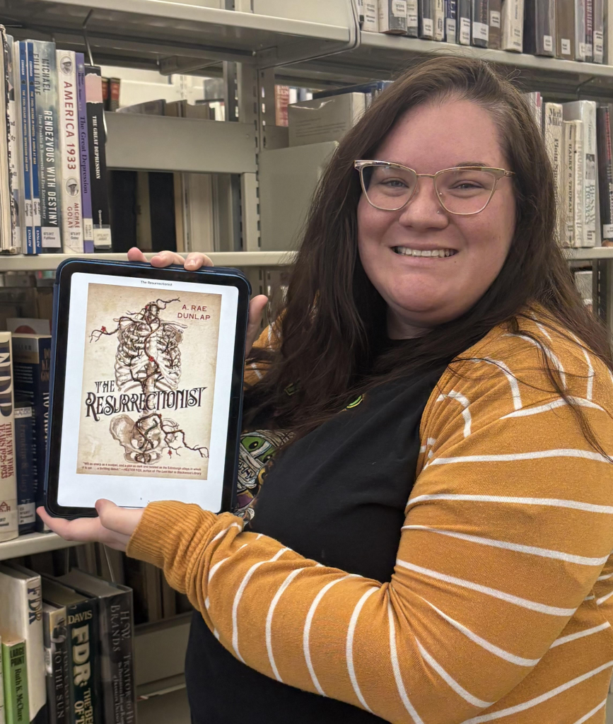 Taylor holding her recommendation. "The Resurrectionist"